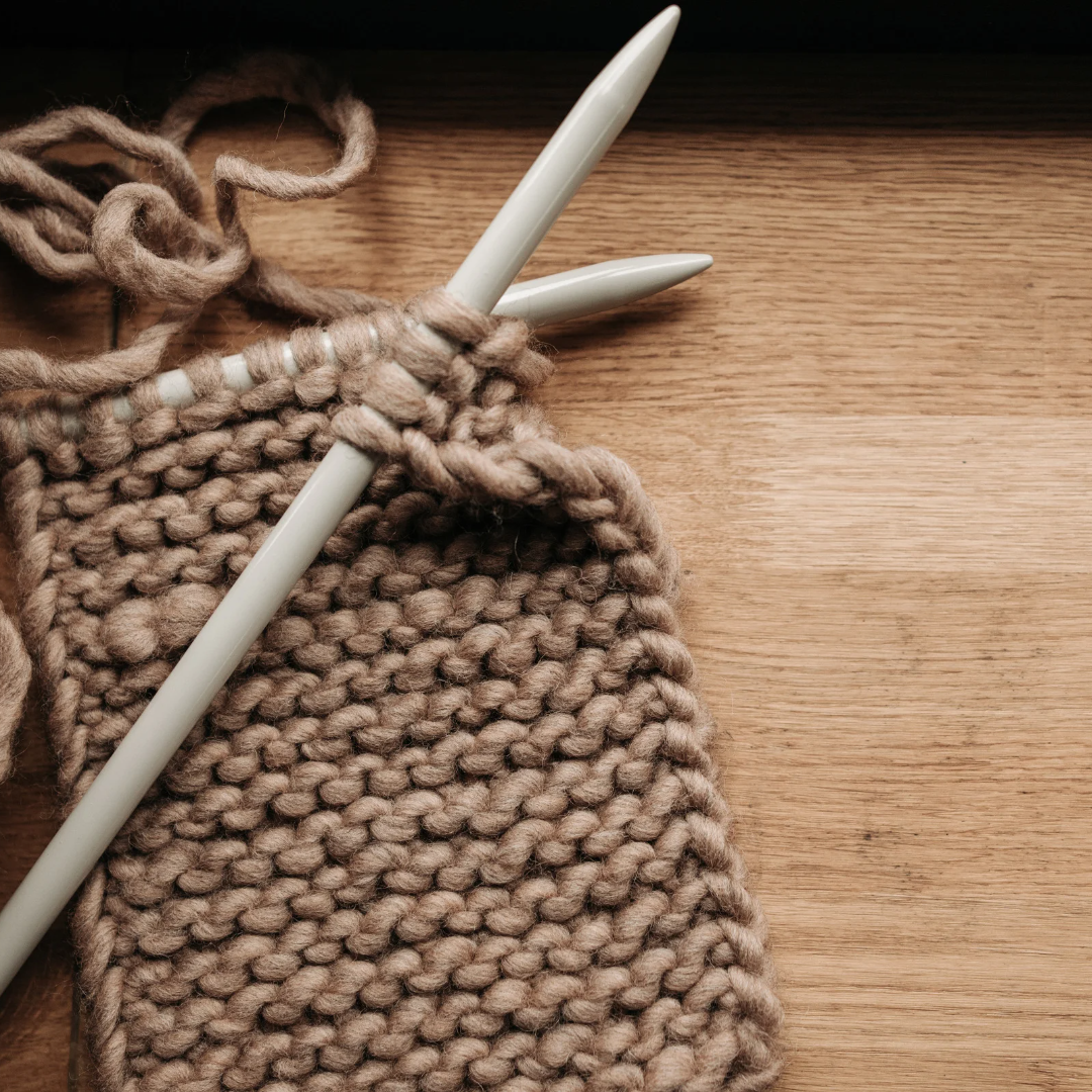Prayer shawl with knitting needle